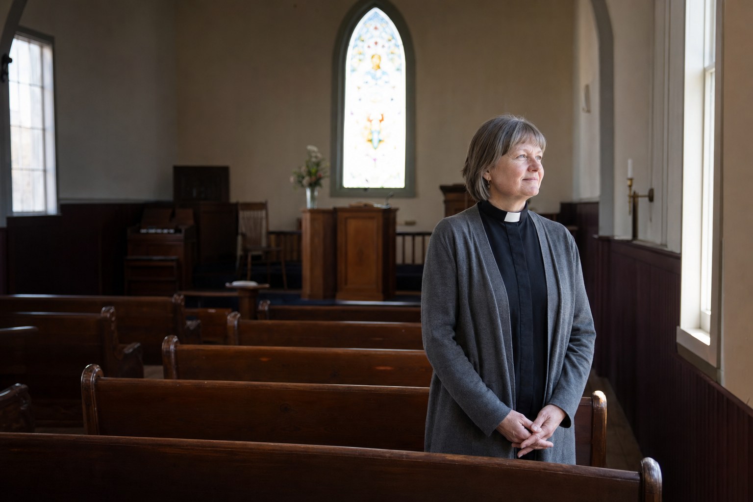 Pastor Joanna standing in the church sanctuary