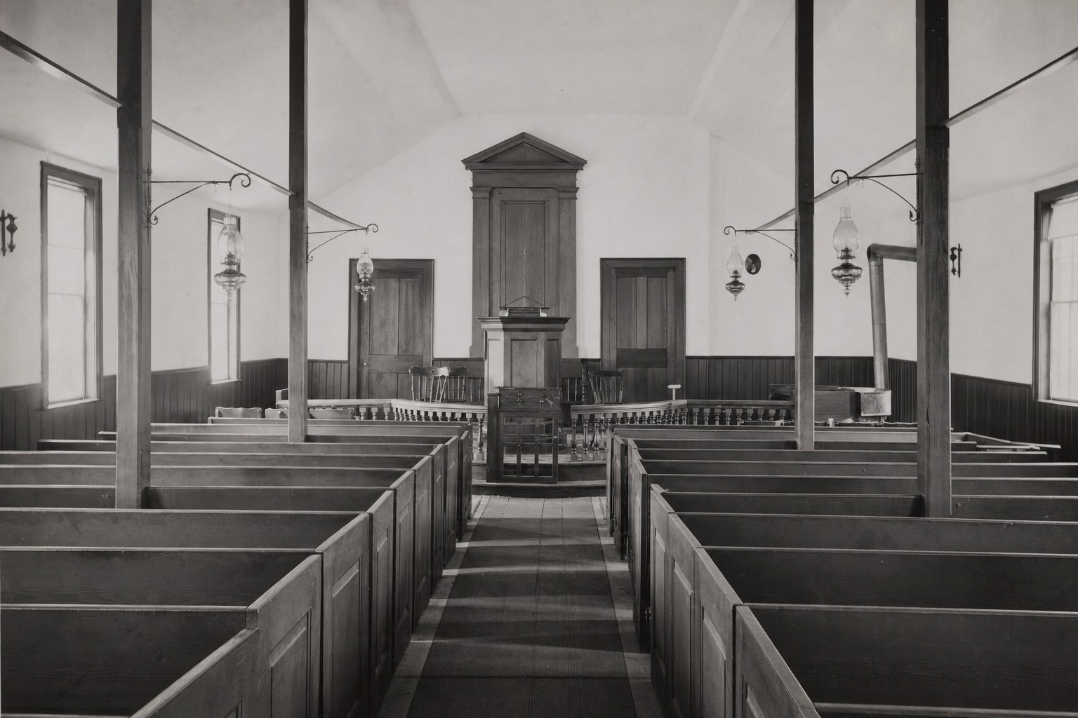 Sanctuary with gas lamps and box pews about 1900